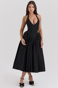 Detail of elegant black deep V-neck halter dress with ruffled waist and puffy A-line skirt