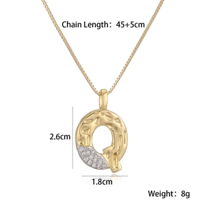 Letter Q pendant necklace with gold hammer texture and cubic zirconia stone detailing