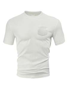 Close-up detail of white men's waffle knit T-shirt with chest pocket and fabric texture