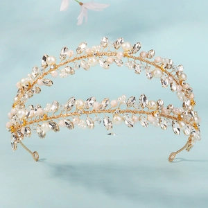 Detailed view of handmade double-layer bridal crown with crystals and pink pearls