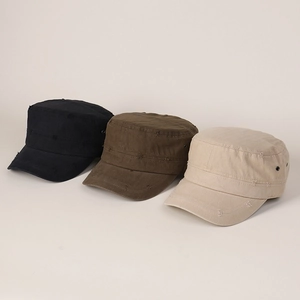 Detailed shot of three distressed flat top cadet hats in black, brown and beige colors
