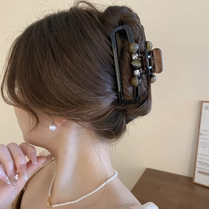Retro square acrylic hair claw clip with faux pearls and rhinestones on hair