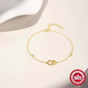 Golden S925 sterling silver interlocking double ring bracelet with Luck engraving and crystals
