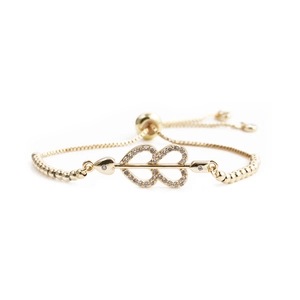Adjustable gold heart bracelet with sparkling zircon Cupid arrow and slider chain clasp