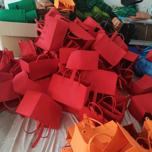 Red and orange felt gift bags with large capacity design showing durable felt material