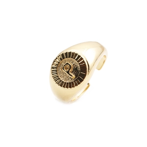 Detailed view of adjustable gold-plated signet ring with engraved letter P design