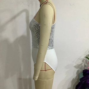 Detail of white bodysuit with silver sequins, thin straps and stretch fabric on mannequin