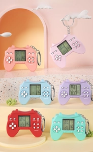 Close-up of mini handheld game console keychains in multiple vibrant colors