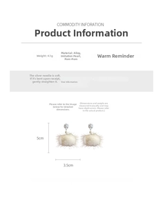 Detail view of pearl and white fur ball earrings with snowflake charm specifications