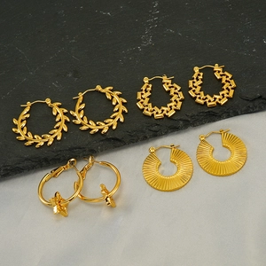 Gold-plated stainless steel hoop earrings set featuring star pendants and textured designs