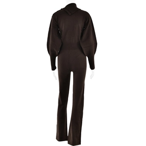 Rear view of dark brown knitted two-piece set featuring long sleeves and straight pants