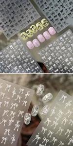 Detail von minimalistischen schwarz-weißen Schleifen-Nagelstickern mit Spitzenmustern
