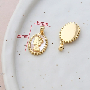 Macro view of 14k gold-filled cameo pendant with shell motif measuring 25mm by 14mm