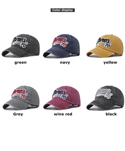 Detail view showing vintage washed cotton baseball caps in multiple colors with embroidery