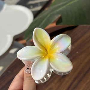 Laser white frangipani flower hair claw clip with yellow center for high ponytail style