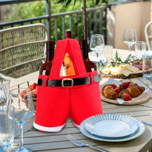 Christmas Santa pants wine bottle cover decoration set on a festive dining table