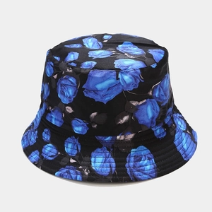 Detailed close-up of blue rose floral pattern on black bucket hat fabric texture