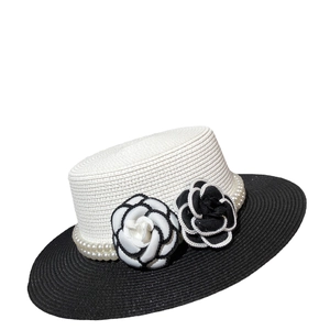 Elegant straw sun hat with black brim, pearl string, and stylish camellia flower decor