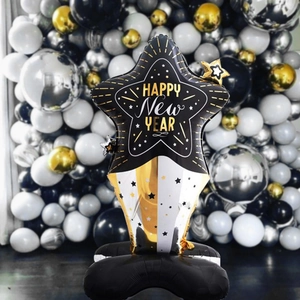 Star-shaped Happy New Year foil balloon tower with gold and silver pillar stand decor