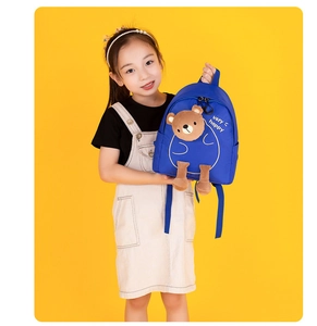 Blue kids backpack with 3D brown bear toy and happy text on a yellow background