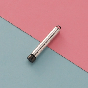 Polished silver stainless steel cylindrical pendant with black cap on dual-tone background