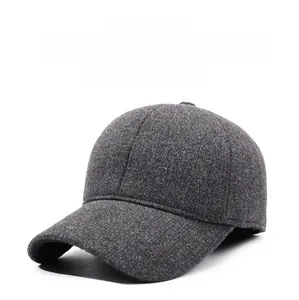 Detail view of dark grey wool winter baseball cap with ear protection flaps