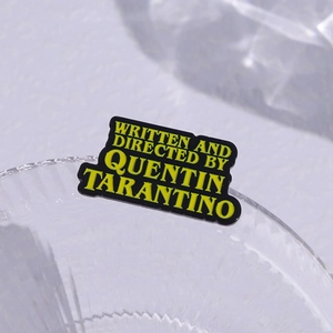 Quentin Tarantino enamel brooch badge with yellow text on black background for movie fans