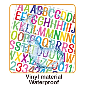 Macro shot of colorful vinyl letter stickers with water drops showing waterproof quality