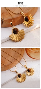 Macro detail of bohemian sun and fan pendants with tiger eye stones on gold snake chains