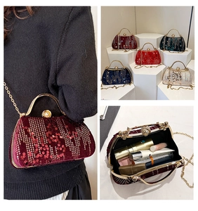 Detail view of velvet sequin evening bag with pearl clasp and chain strap in five colors