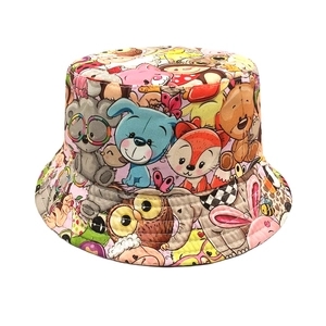 Detailed pattern view of a pink kids sun hat with cartoon animal prints like bears and foxes