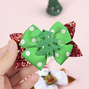 Glittery Christmas tree hair bow clip for girls featuring green polka dots and red sequins