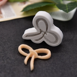 White silicone bow mold for DIY cake mousse and chocolate with silk texture detail