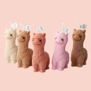 Macro detail of cute alpaca silicone molds for candles in five assorted pastel colors