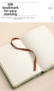 Detail of A6 floral fabric notebook featuring lined cream paper and a brown silk ribbon bookmark
