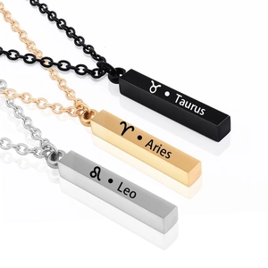 Detailed close-up of zodiac bar necklaces in black, gold, and silver stainless steel