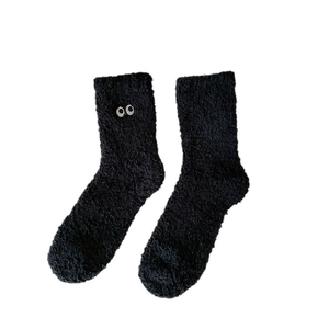 Thick black coral fleece thermal socks with cute embroidered eyes for winter warmth