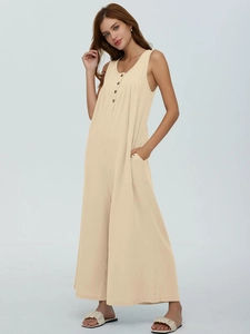 Detail of beige sleeveless wide-leg jumpsuit with button front and pocket features