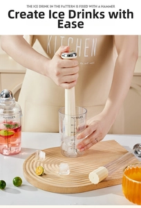 Action shot of an ice muddler tool with a 500ml scaled cup for making lemon tea