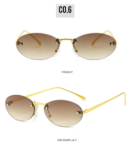 Macro detail of rimless oval sunglasses with gradient brown lenses and gold metal frames