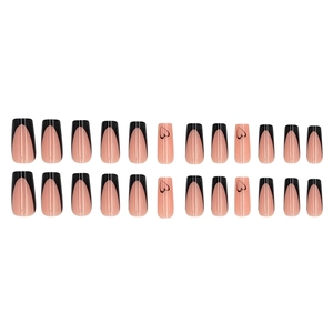 French tip press-on nails in nude pink with black heart patterns and square shape