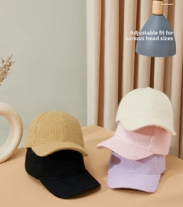 Detail of warm knitted baseball caps in various colors with textured ribbed knit finish
