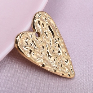 Macro view of gold-plated 304 stainless steel heart pendant with hammered texture detail