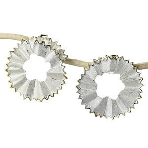 S925 sterling silver pencil shaving earrings with gold trim on a decorative branch