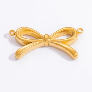 Detailed view of an 18k gold-plated bow-shaped metal jewelry connector with side loops
