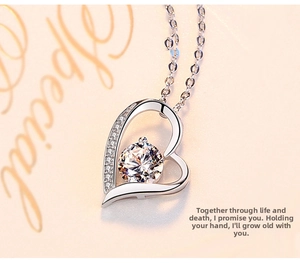 Macro view of S925 silver heart necklace featuring a sparkling central round zircon
