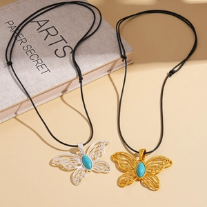Ethnic filigree butterfly pendant necklace with turquoise stone on black cord