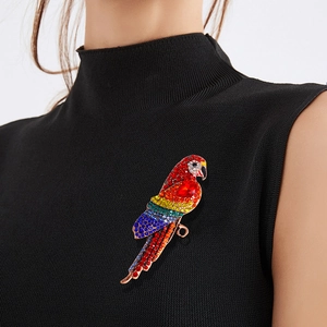 Vintage oversized parrot brooch with colorful rhinestones on elegant black clothing