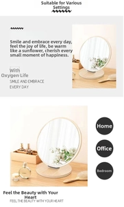 Detail of wooden swivel vanity mirror showing a round natural frame and stable base