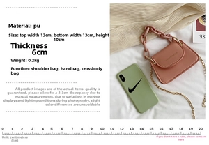 Pink jelly mini crossbody bag featuring a resin ring handle and gold chain strap detail